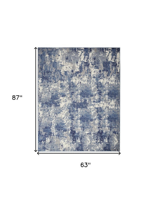 5' X 7' Blue and Ivory Abstract Power Loom Area Rug