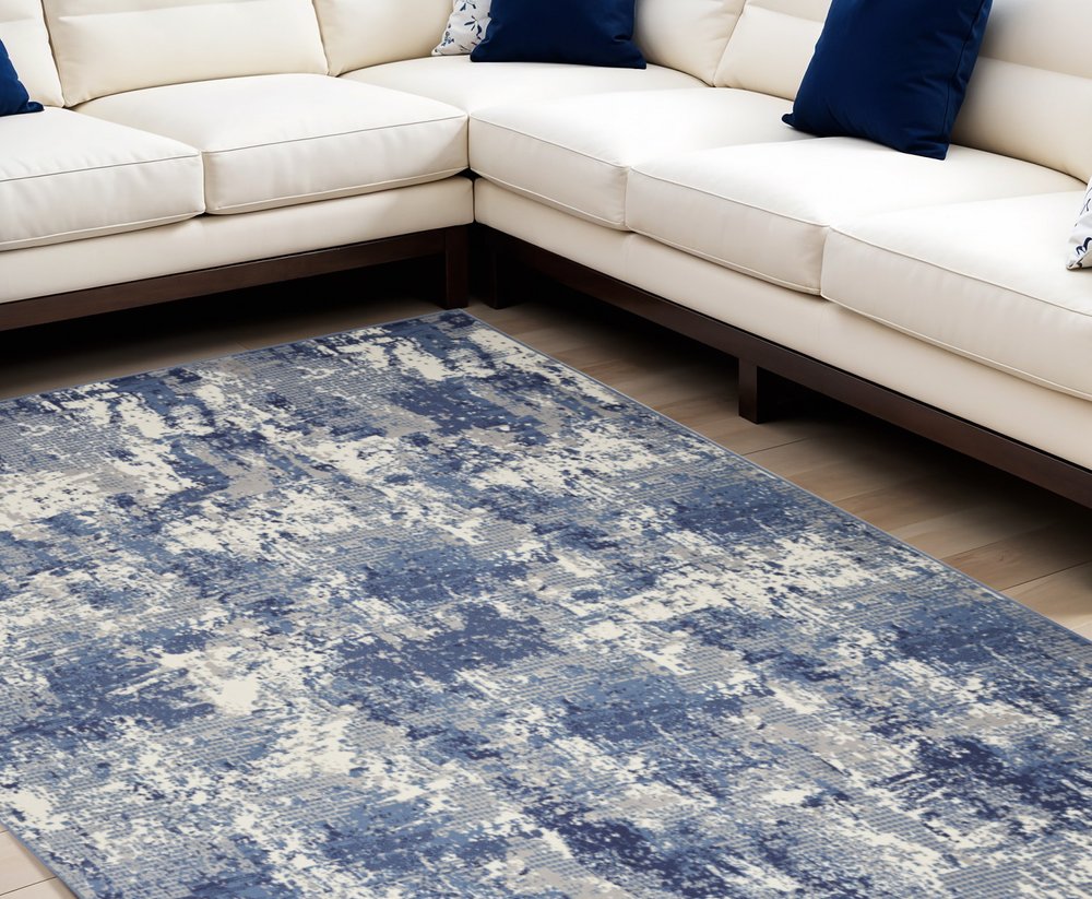 8' X 10' Blue and Ivory Abstract Power Loom Area Rug