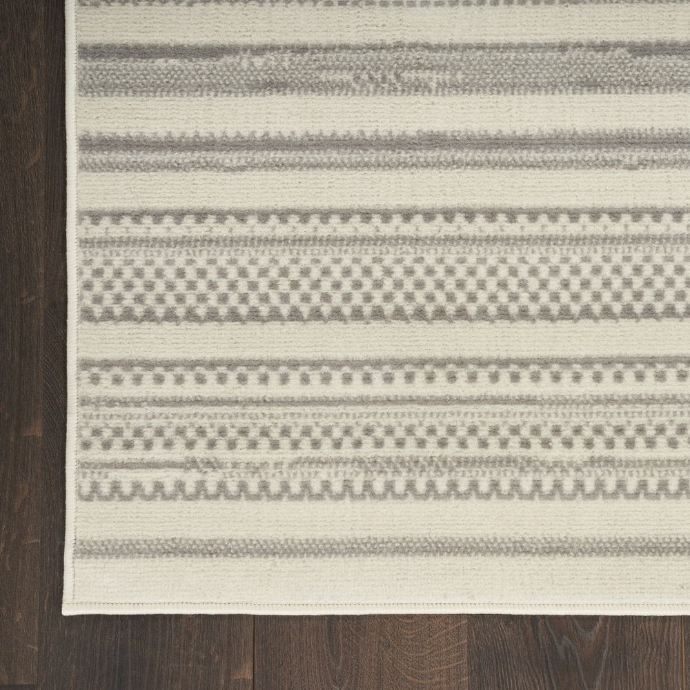 5' X 7' Gray and Ivory Striped Power Loom Distressed Area Rug