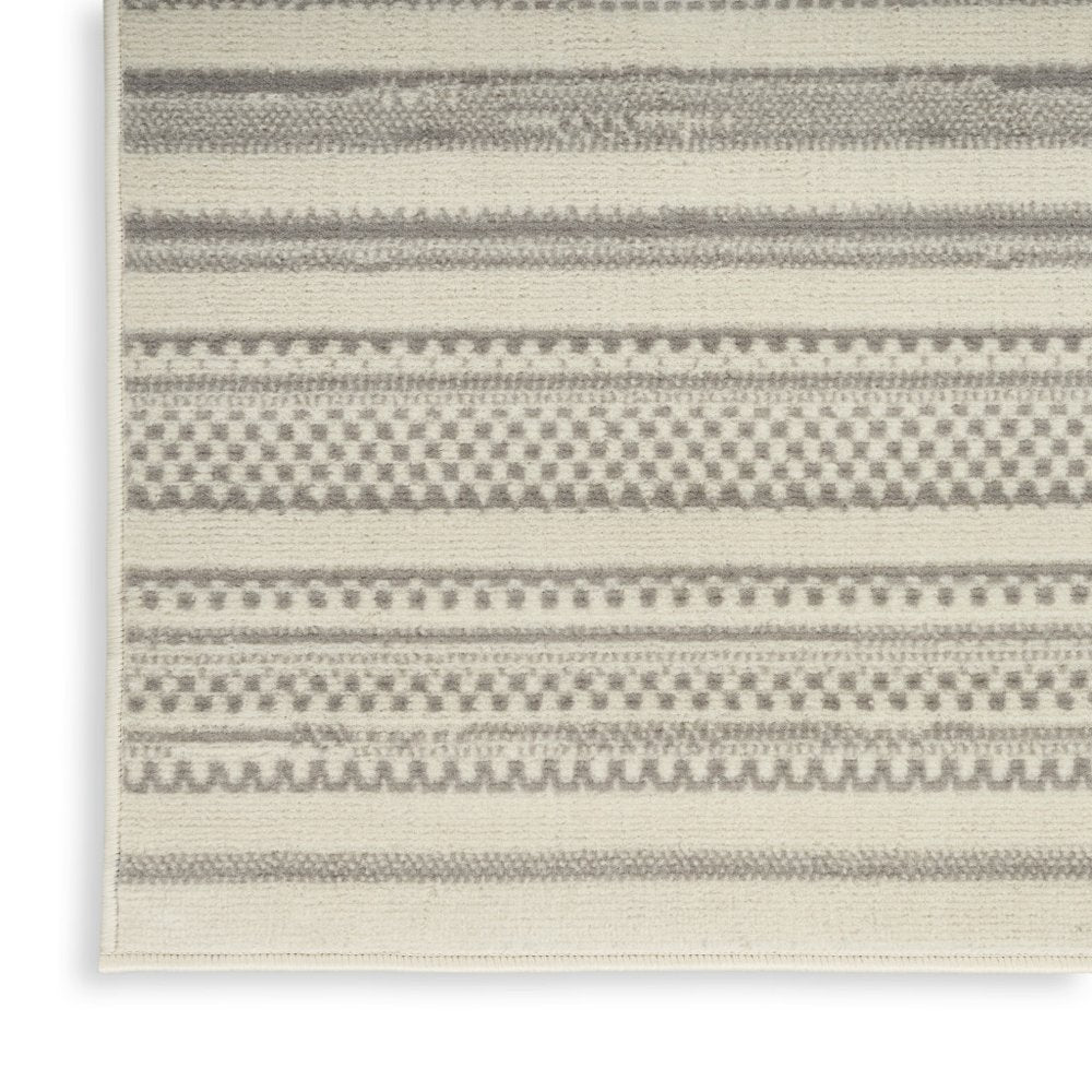 5' X 7' Gray and Ivory Striped Power Loom Distressed Area Rug