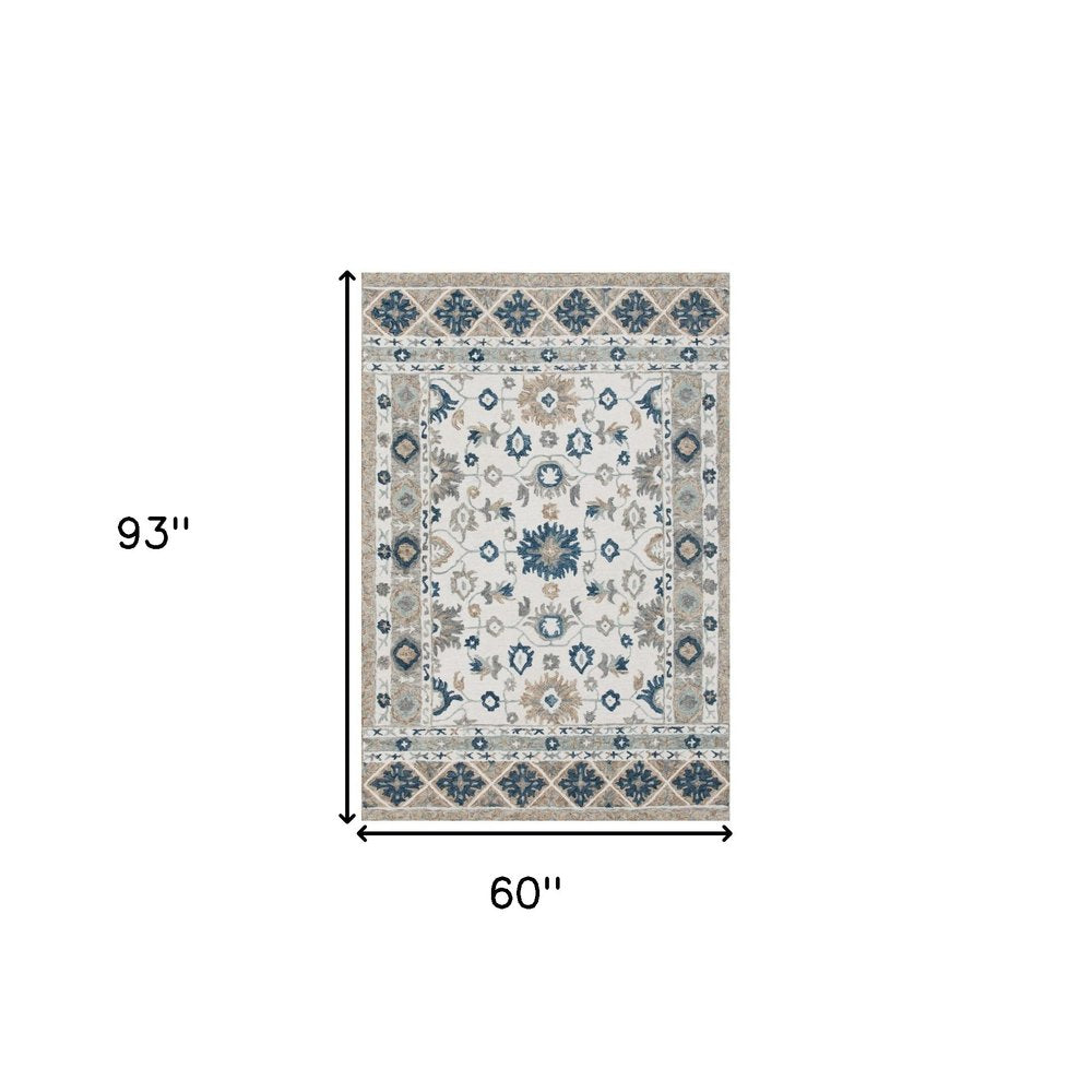 9' X 12' Blue and Ivory Wool Floral Hand Tufted Area Rug