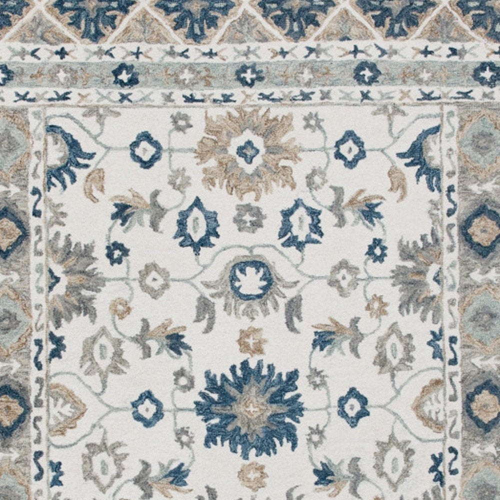 9' X 12' Blue and Ivory Wool Floral Hand Tufted Area Rug