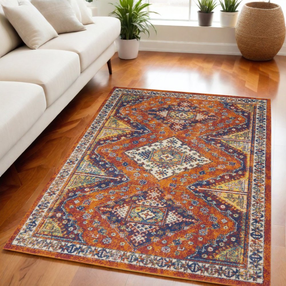 5' X 7' Ivory Blue and Orange Geometric Power Loom Area Rug
