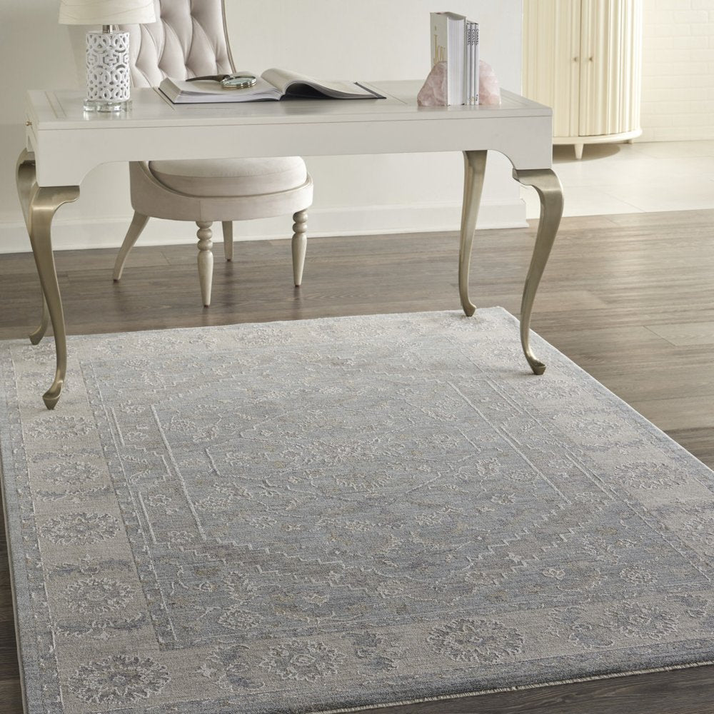 4' X 6' Beige and Blue Floral Power Loom Area Rug