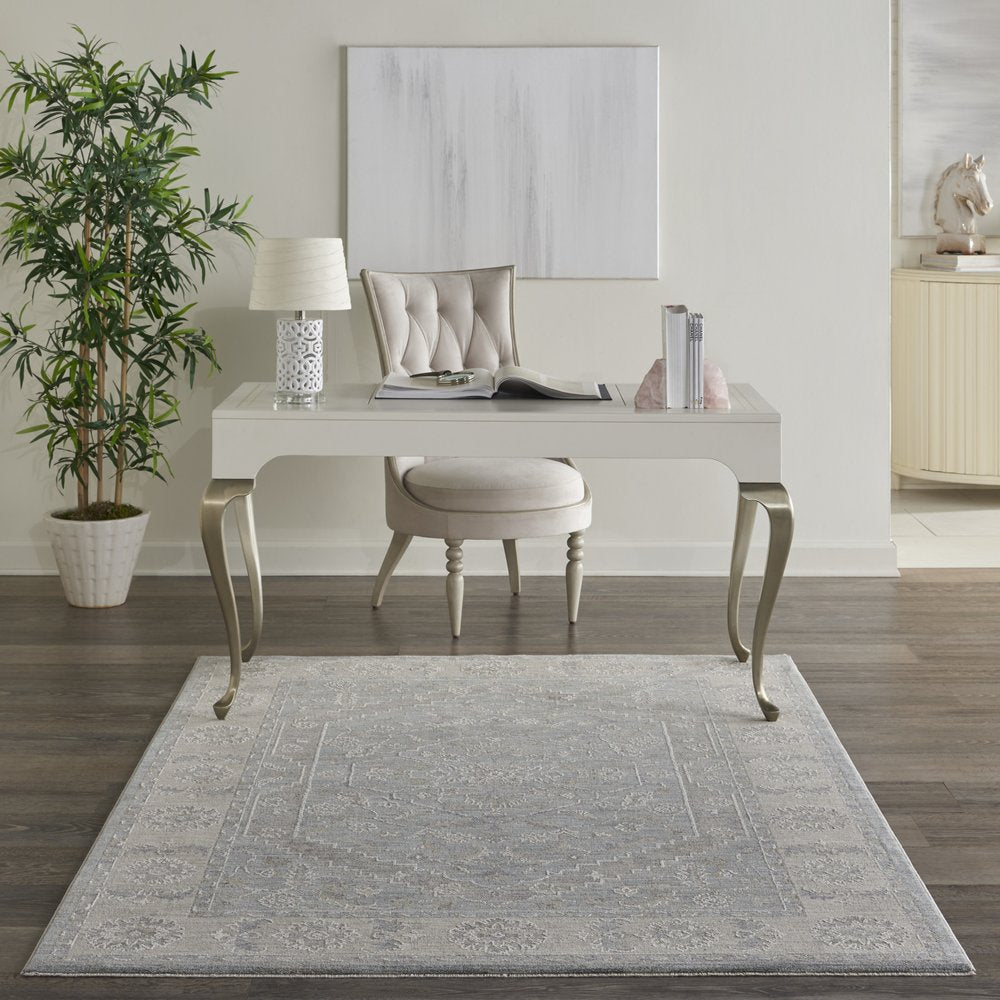 4' X 6' Beige and Blue Floral Power Loom Area Rug