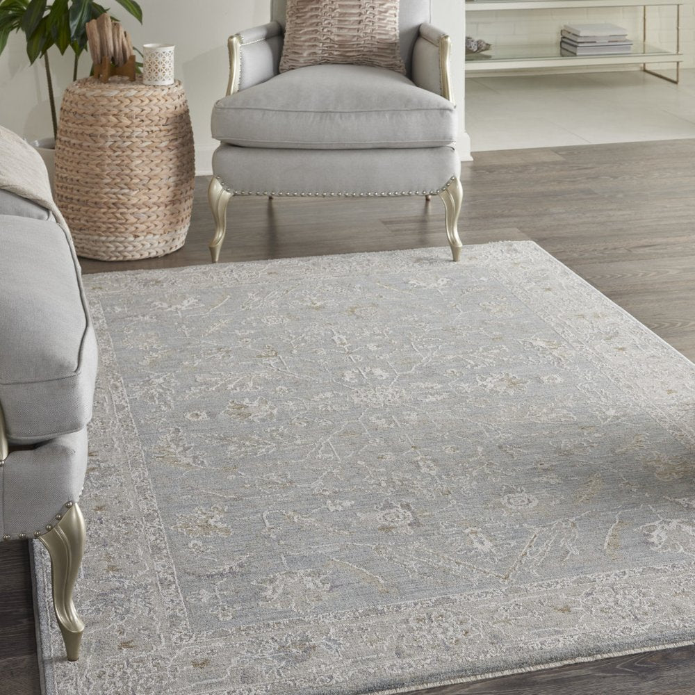 5' X 8' Beige and Blue Floral Power Loom Area Rug