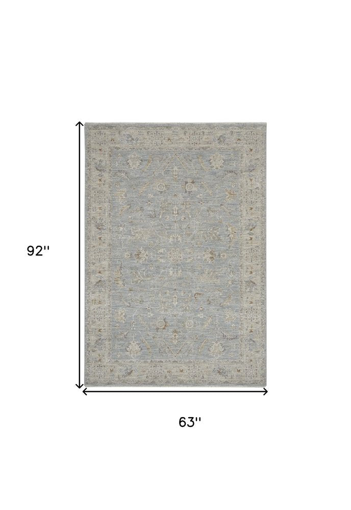 5' X 8' Beige and Blue Floral Power Loom Area Rug