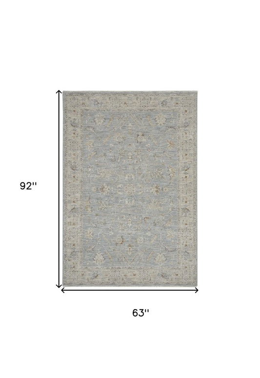 5' X 8' Beige and Blue Floral Power Loom Area Rug