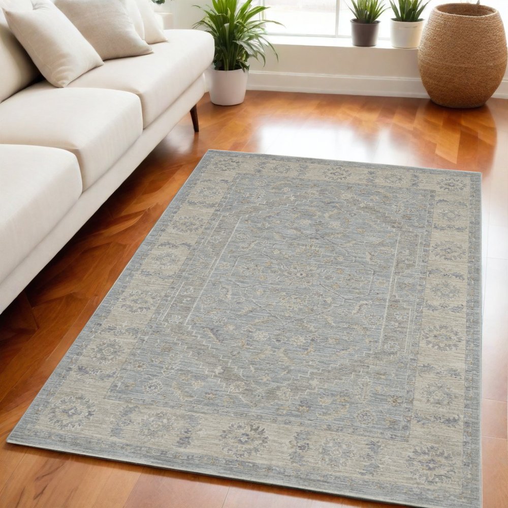 5' X 8' Beige and Blue Floral Power Loom Area Rug
