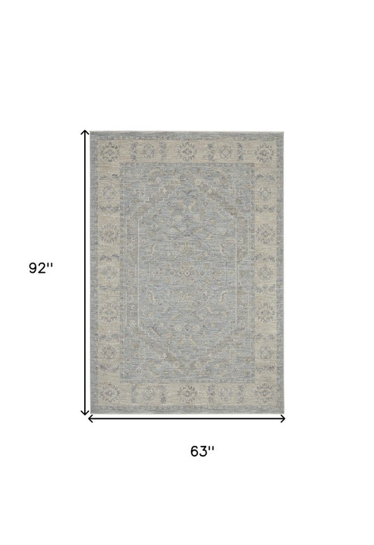 5' X 8' Beige and Blue Floral Power Loom Area Rug