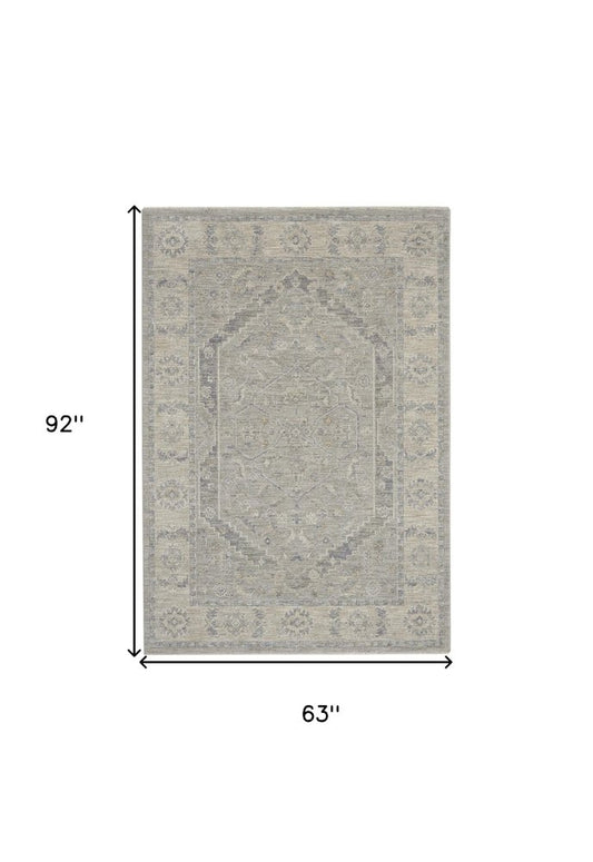 5' X 8' Beige and Gray Floral Medallion Power Loom Area Rug