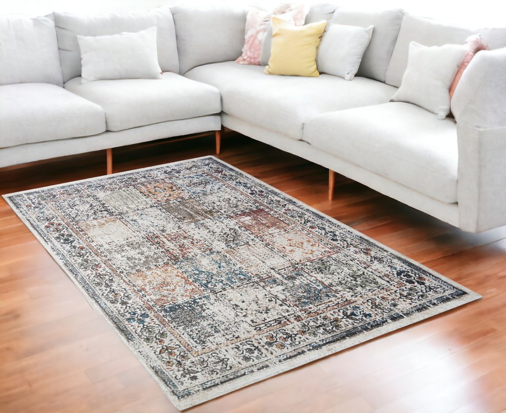 5' X 8' Ivory Oriental Distressed Area Rug With Fringe