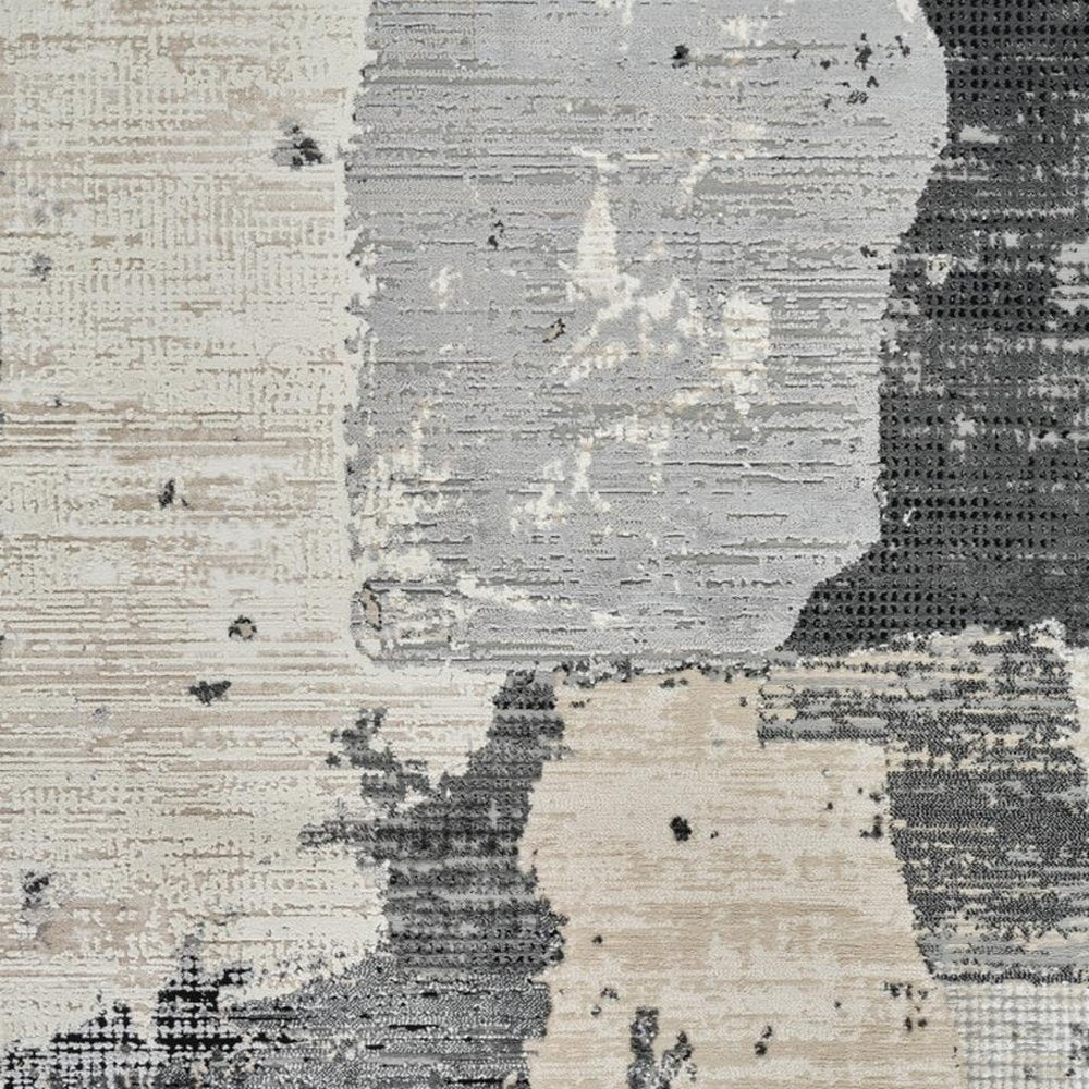 5' X 8' Beige and Black Abstract Distressed Area Rug