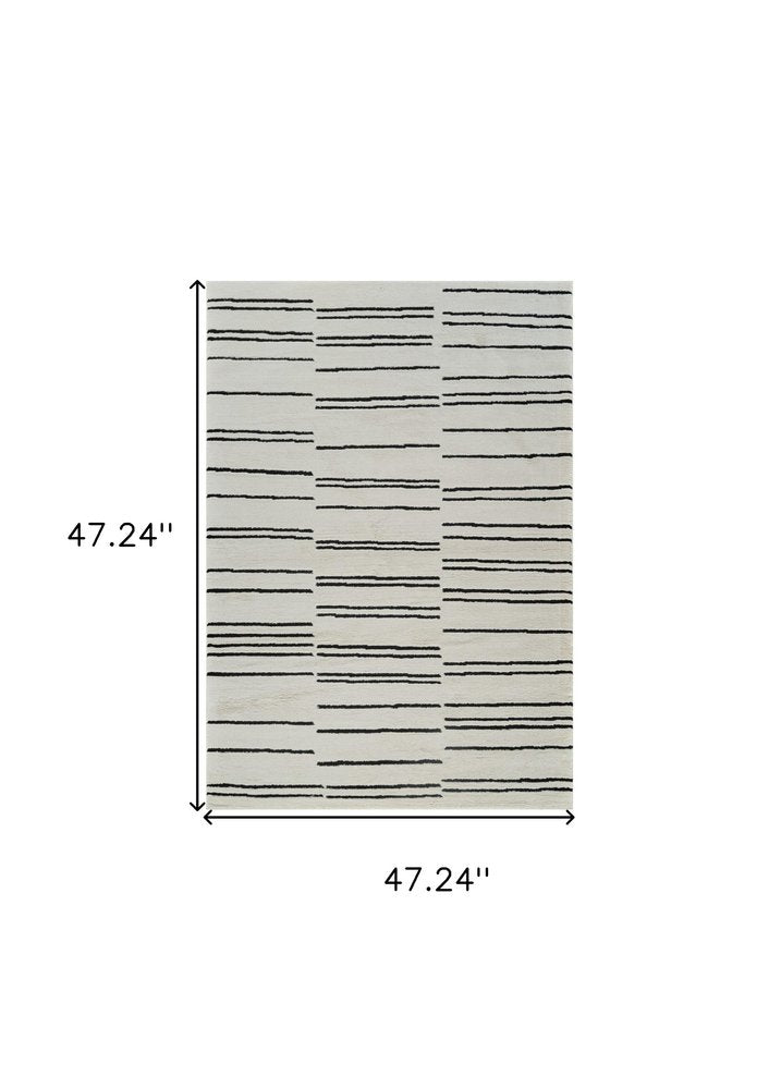 4' X 6' Cream and Black Abstract Distressed Area Rug