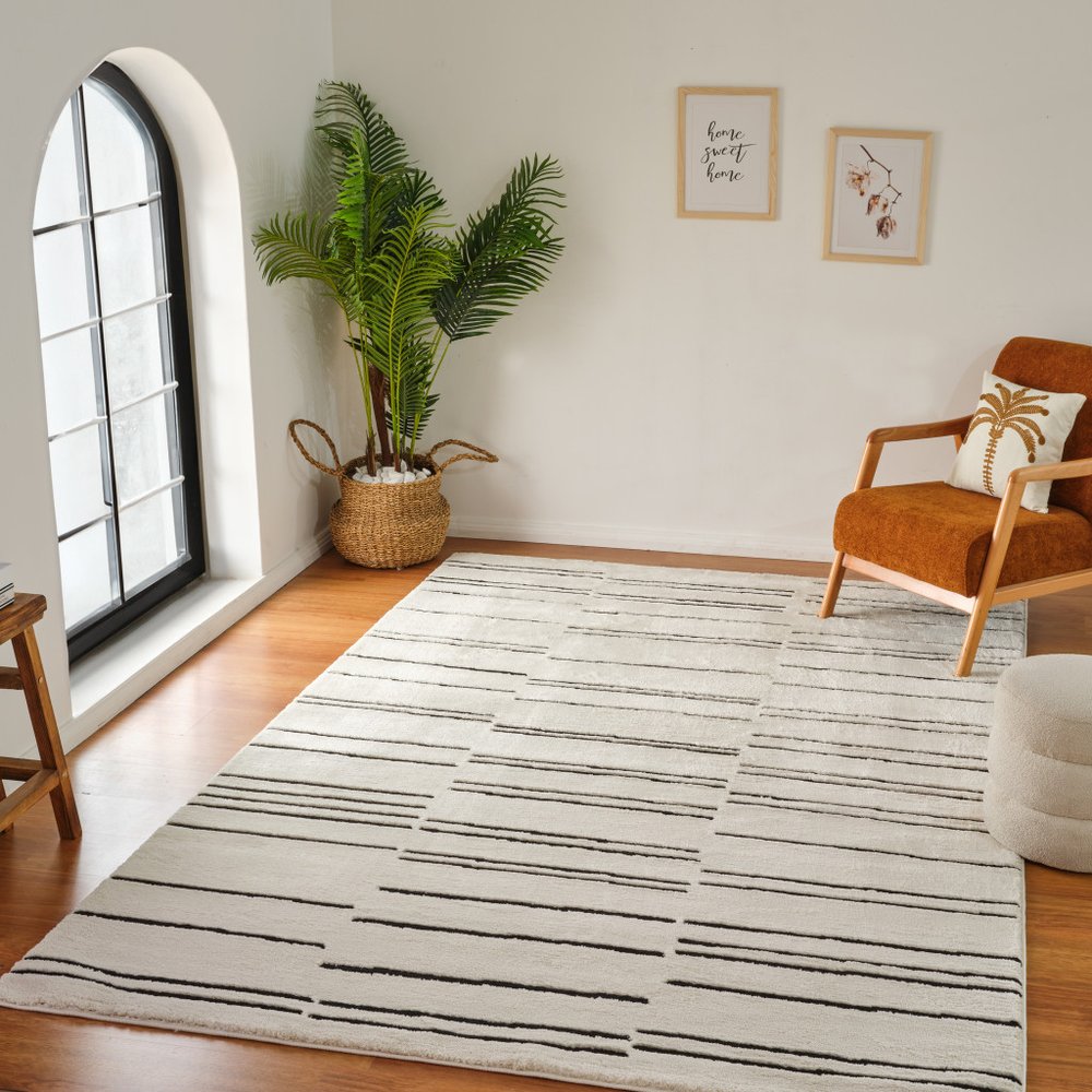 4' X 6' Cream and Black Abstract Distressed Area Rug