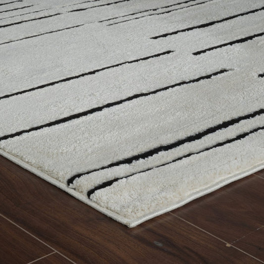 5' X 8' Cream and Black Abstract Worn Faded Area Rug