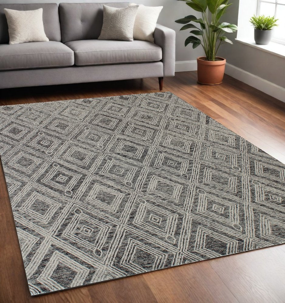 5' X 8' Black and Ivory Wool Abstract Geometric Hand Tufted Non Skid Area Rug