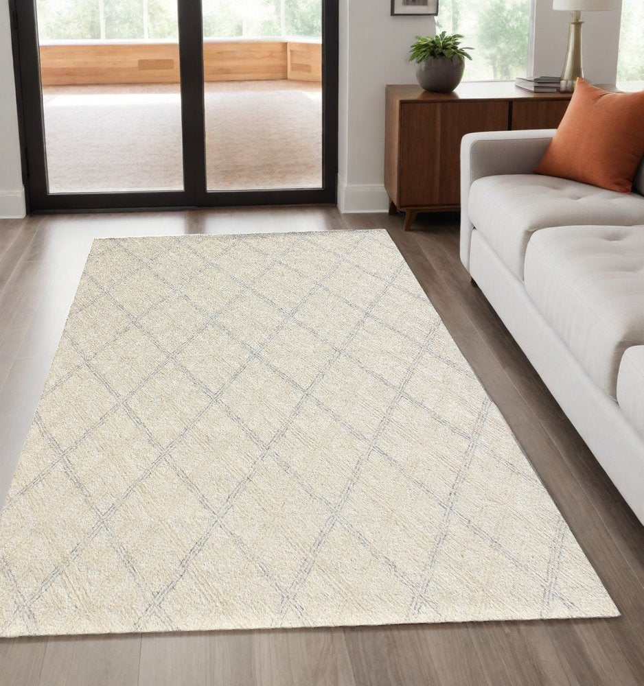 5' X 8' Ivory Wool Abstract Geometric Hand Tufted Non Skid Area Rug