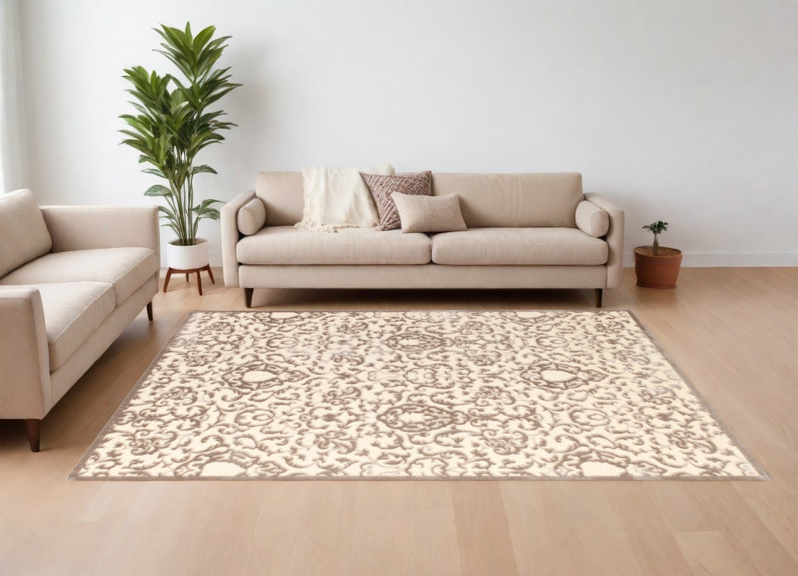 5' X 8' Taupe and Tan Floral Power Loom Area Rug