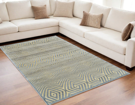 5' X 8' Tan and Gray Abstract Power Loom Area Rug