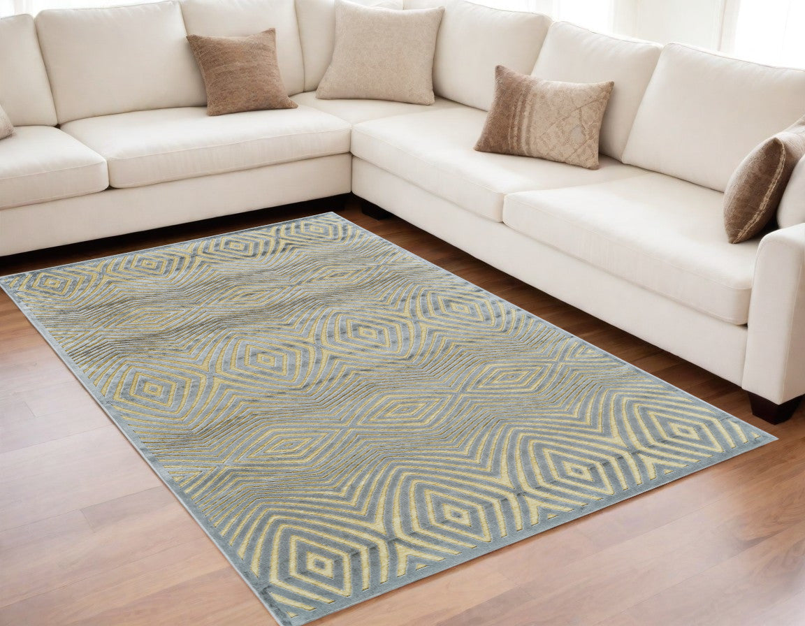 5' X 8' Tan and Gray Abstract Power Loom Area Rug