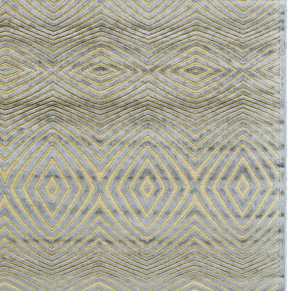 5' X 8' Tan and Gray Abstract Power Loom Area Rug