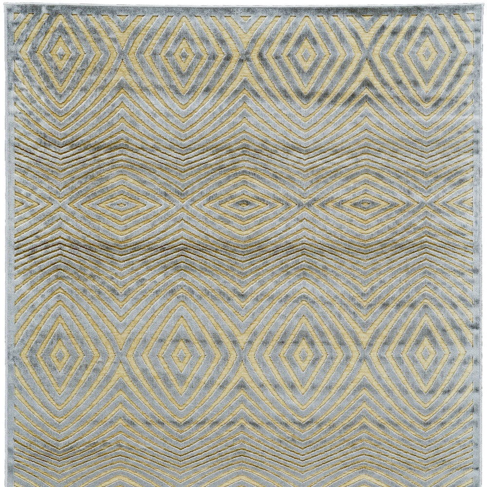 5' X 8' Tan and Gray Abstract Power Loom Area Rug