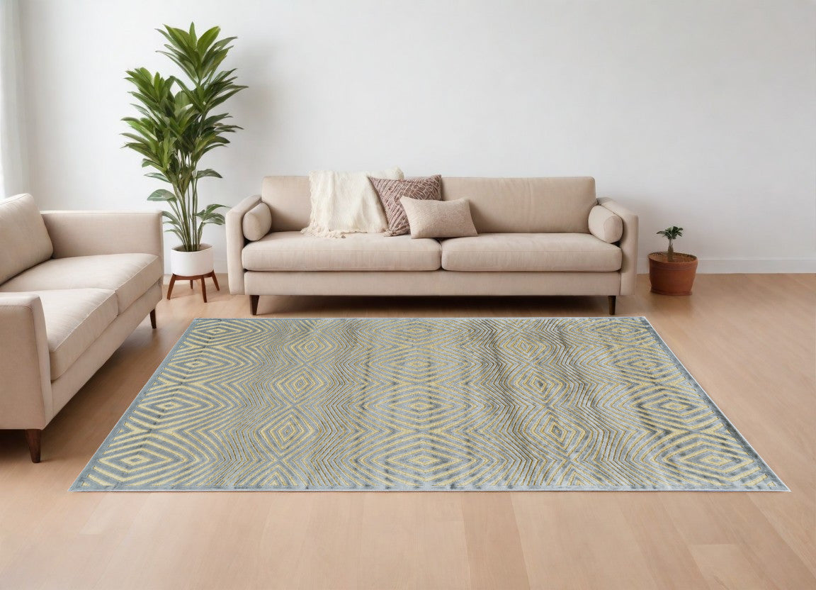 5' X 8' Tan and Gray Abstract Power Loom Area Rug