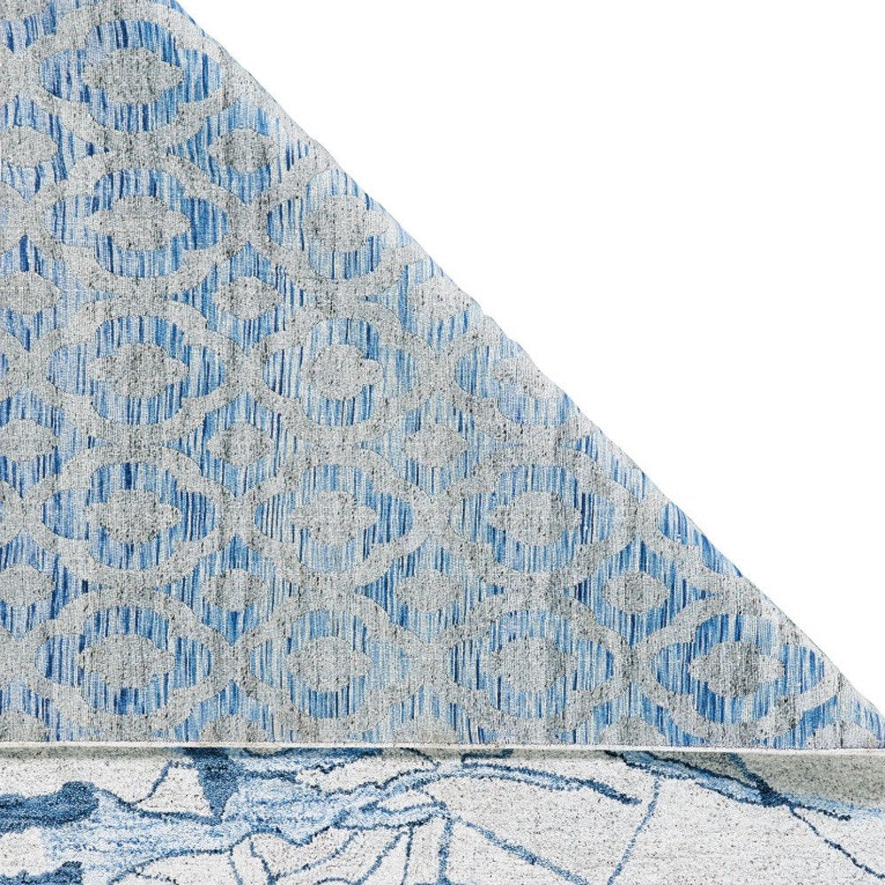 7' X 9' Blue and Ivory Abstract Hand Tufted Area Rug