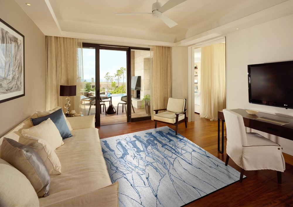 7' X 9' Blue and Ivory Abstract Hand Tufted Area Rug