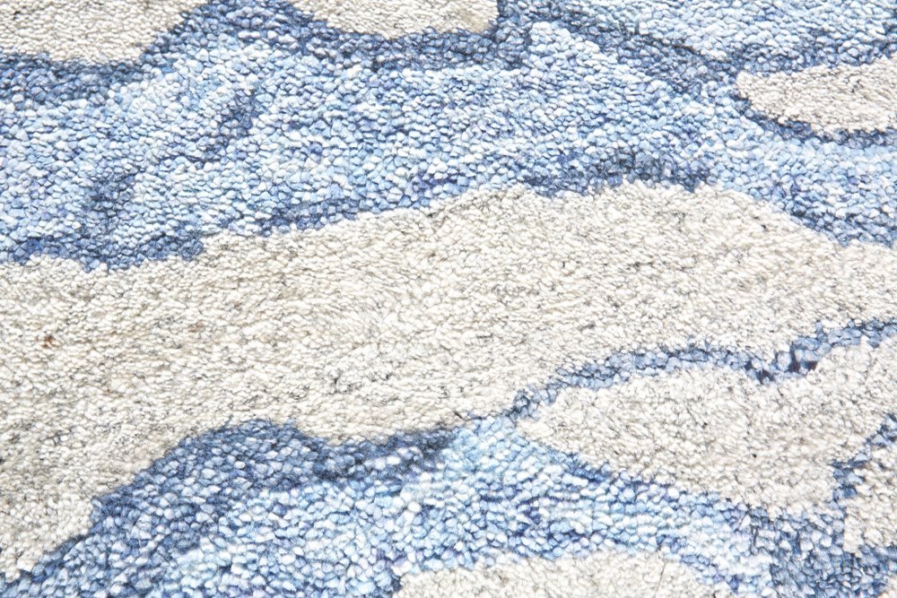 7' X 9' Blue and Ivory Abstract Hand Tufted Area Rug