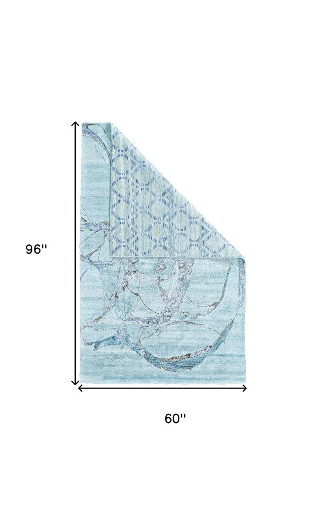 5' X 8' Blue and Ivory Abstract Hand Tufted Area Rug