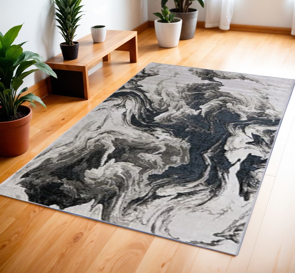 5' X 8' Ivory Black and Taupe Abstract Power Loom Area Rug