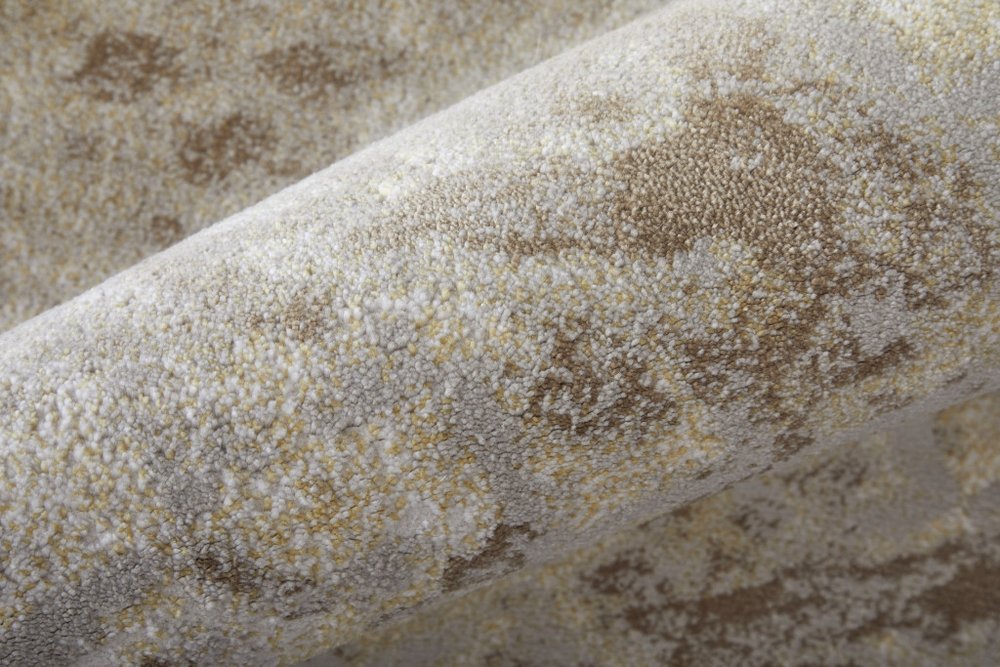 5' X 8' Tan and Ivory Abstract Power Loom Worn Faded Area Rug