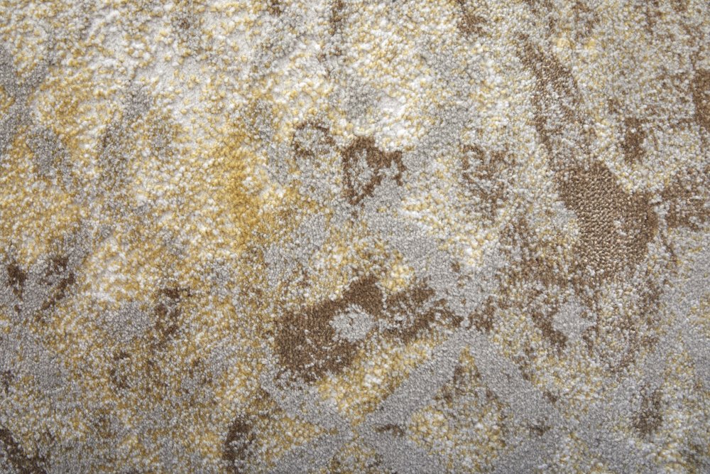 5' X 8' Tan and Ivory Abstract Power Loom Worn Faded Area Rug