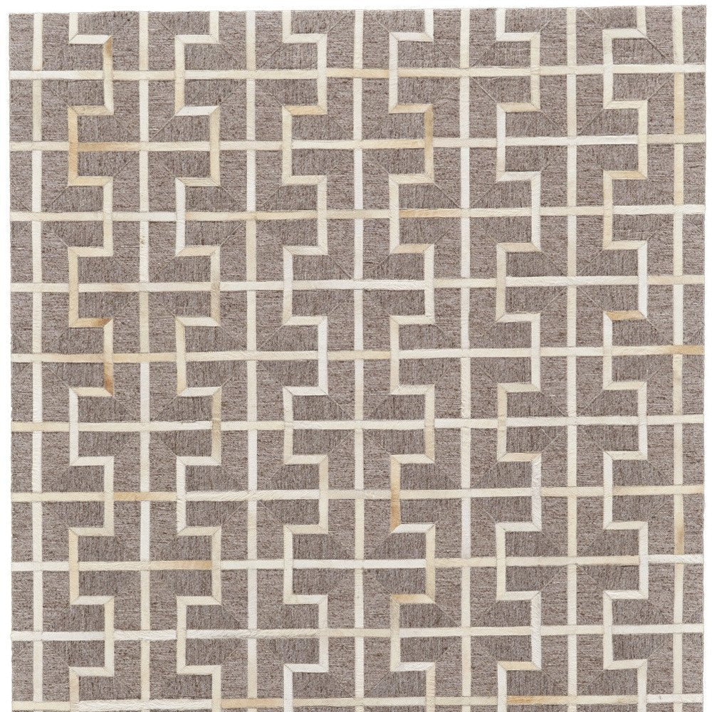 5' X 8' Tan and Ivory Geometric Hand Woven Area Rug