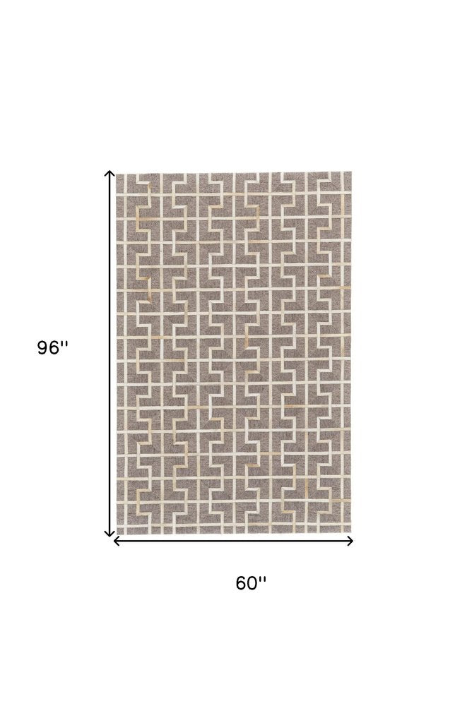 5' X 8' Tan and Ivory Geometric Hand Woven Area Rug
