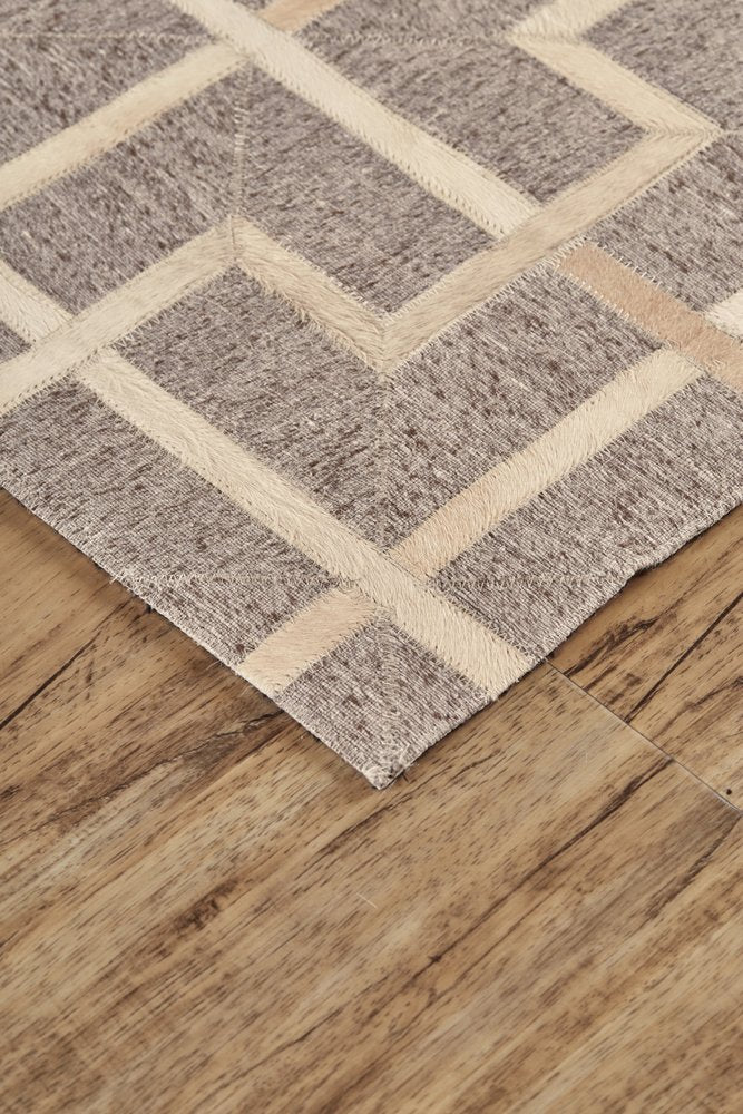 5' X 8' Tan and Ivory Geometric Hand Woven Area Rug