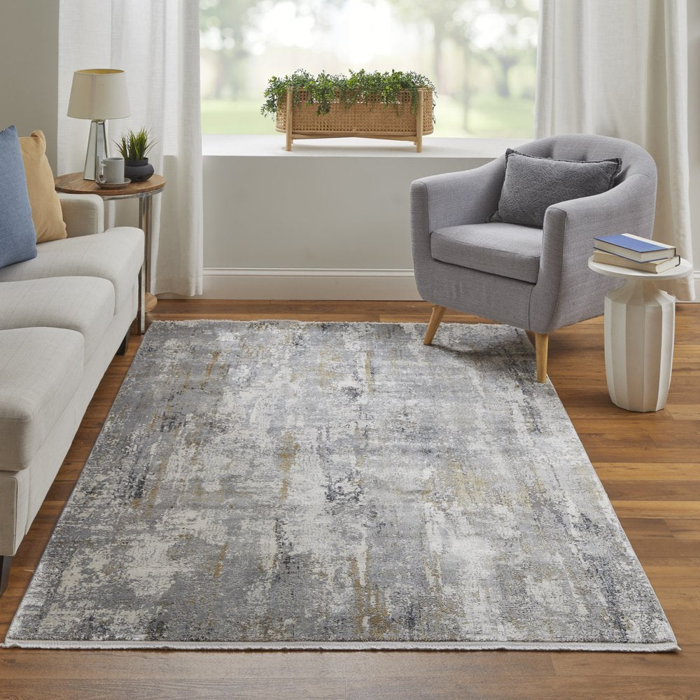 3' X 5' Gray Ivory and Gold Abstract Power Loom Area Rug With Fringe