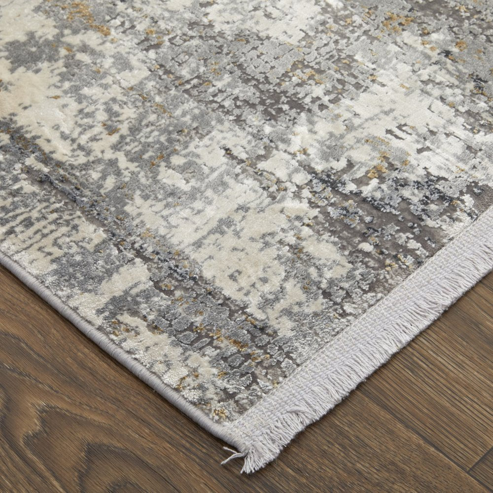 3' X 5' Gray Ivory and Gold Abstract Power Loom Area Rug With Fringe