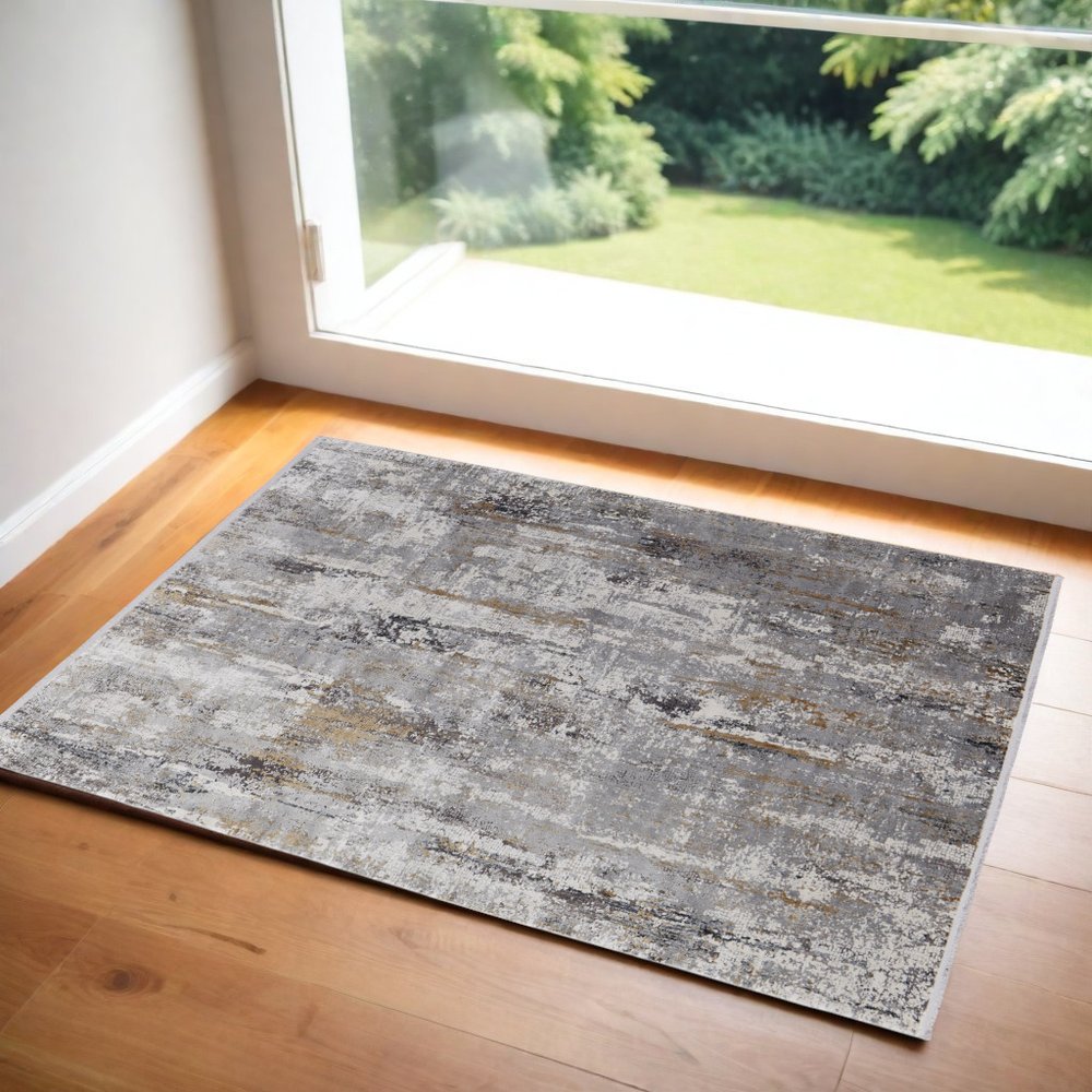 3' X 5' Gray Ivory and Gold Abstract Power Loom Area Rug With Fringe