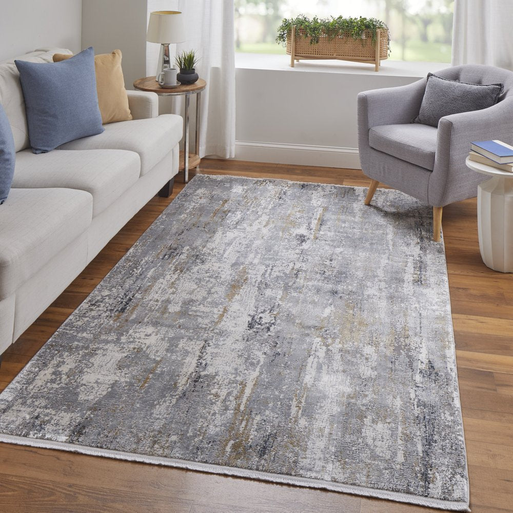 3' X 5' Gray Ivory and Gold Abstract Power Loom Area Rug With Fringe