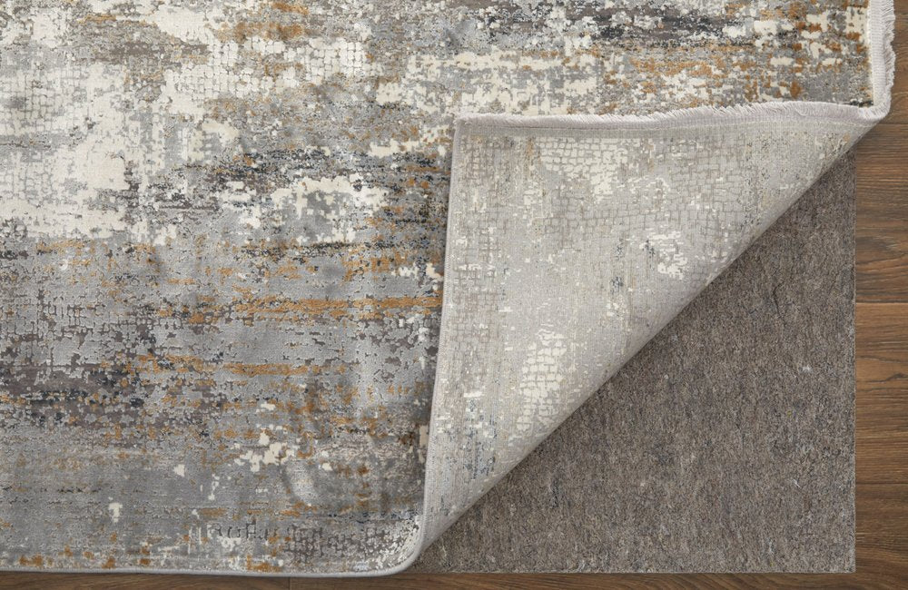 3' X 5' Gray Ivory and Gold Abstract Power Loom Area Rug With Fringe