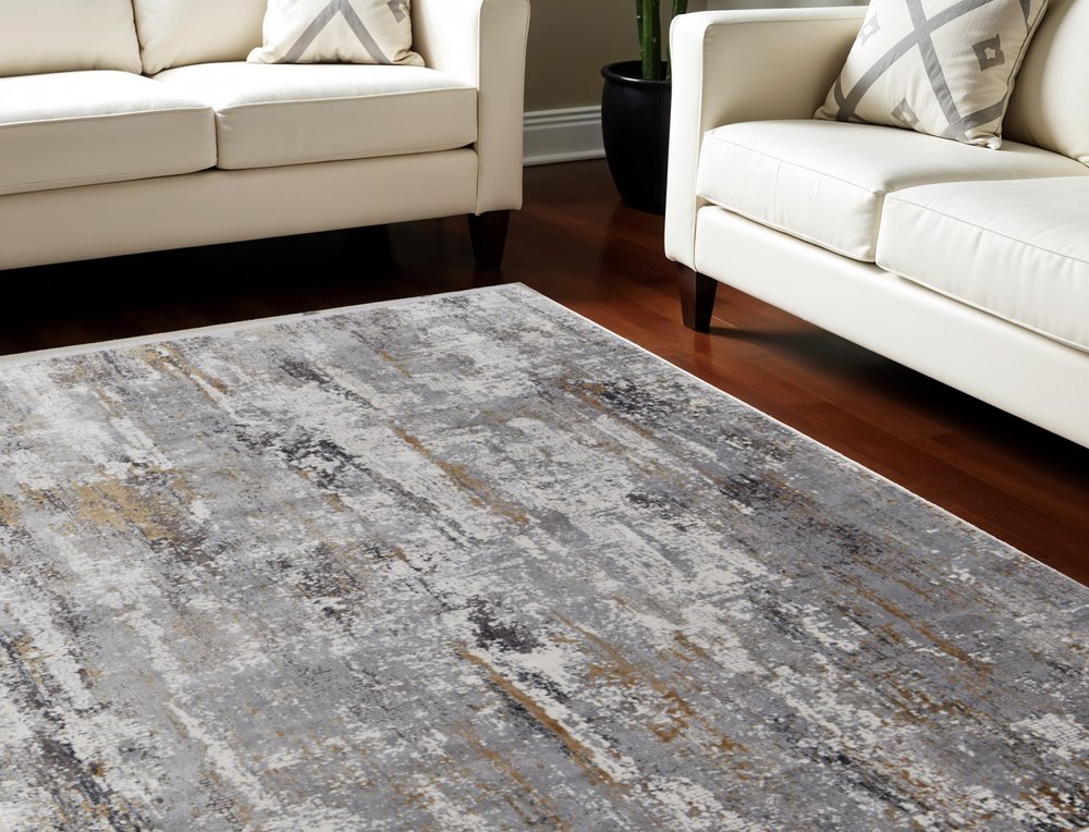 3' X 5' Gray Ivory and Gold Abstract Power Loom Area Rug With Fringe