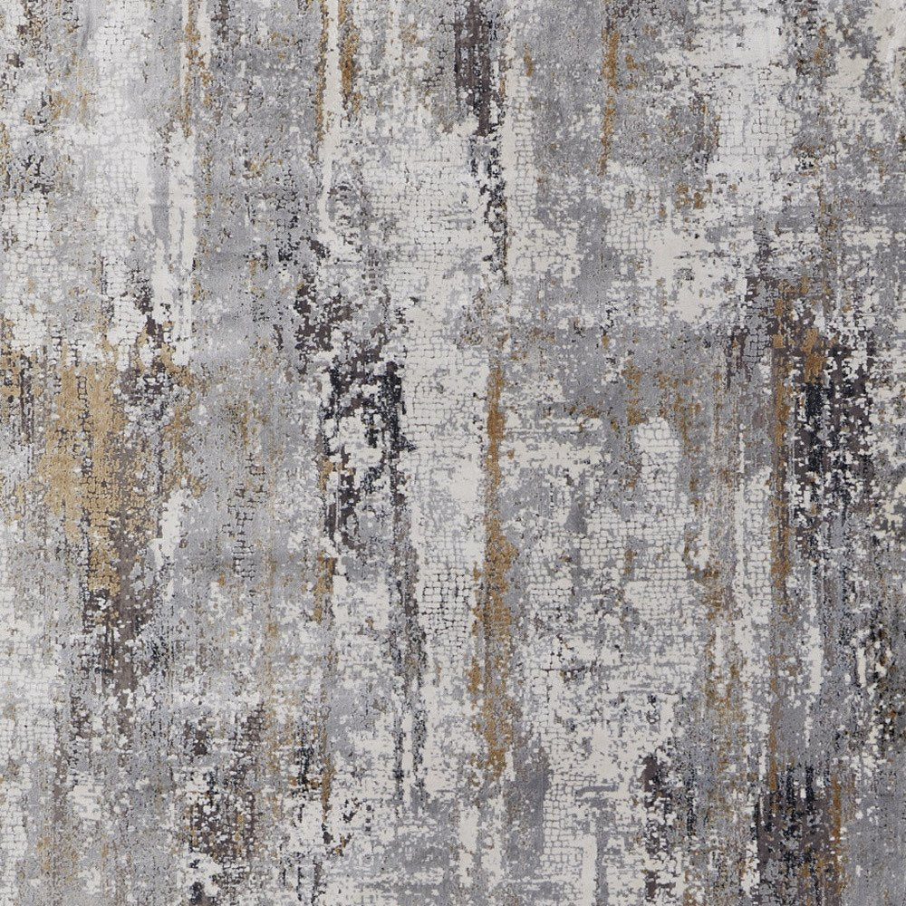 3' X 5' Gray Ivory and Gold Abstract Power Loom Area Rug With Fringe