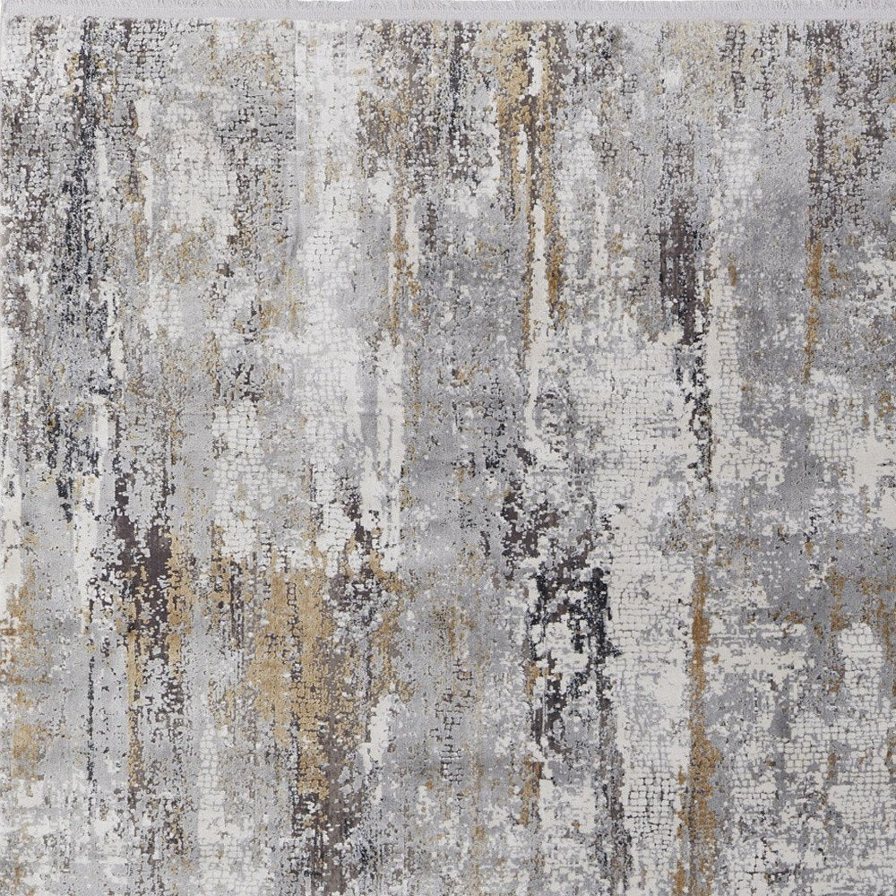 3' X 5' Gray Ivory and Gold Abstract Power Loom Area Rug With Fringe