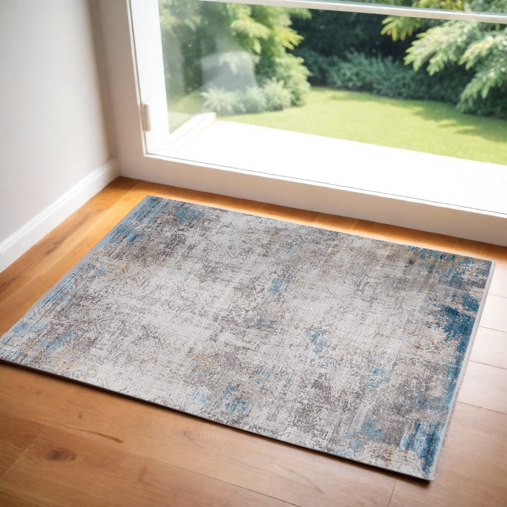 5' X 8' Ivory Gray and Blue Abstract Power Loom Area Rug With Fringe