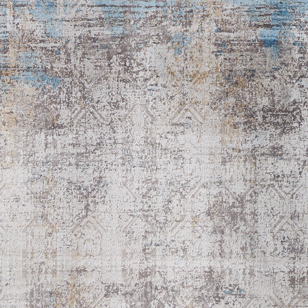 5' X 8' Ivory Gray and Blue Abstract Power Loom Area Rug With Fringe