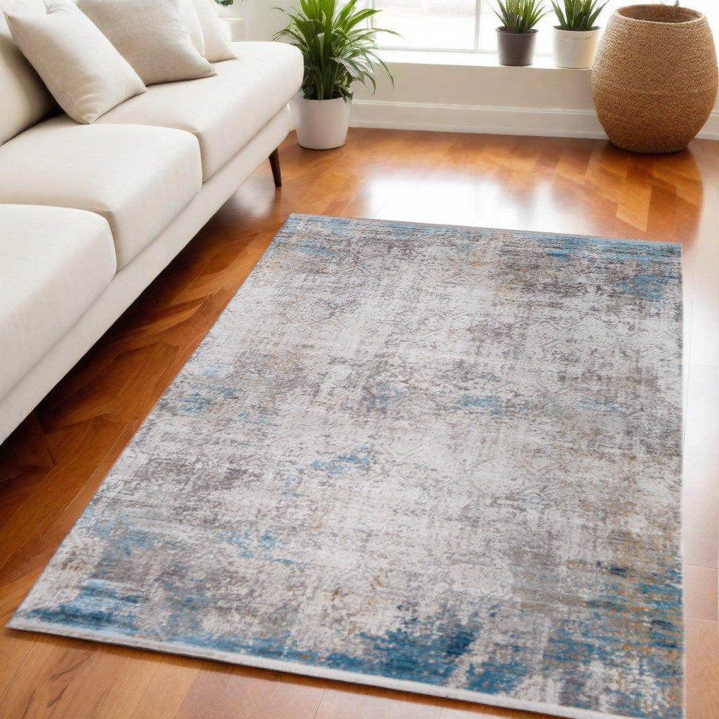 5' X 8' Ivory Gray and Blue Abstract Power Loom Area Rug With Fringe