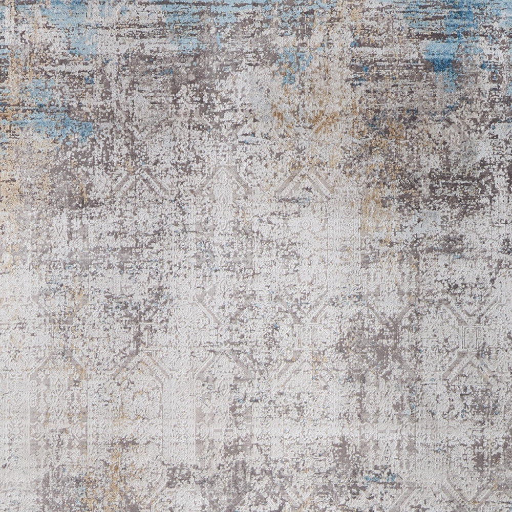 5' X 8' Ivory Gray and Blue Abstract Power Loom Area Rug With Fringe